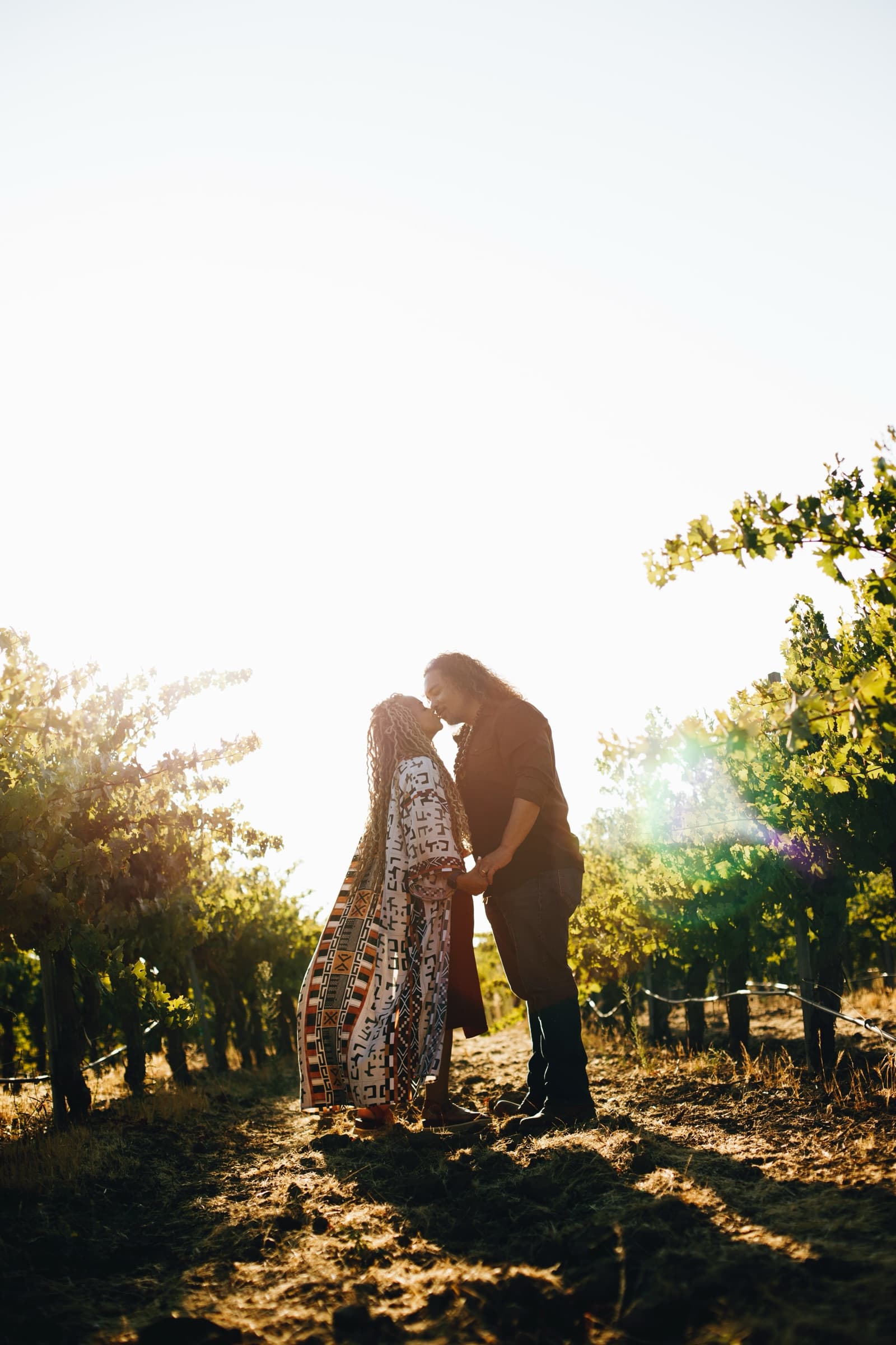 Koa and Brandie Kekoa at golden hour in the vineyard